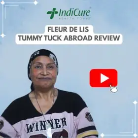 A headshot of a woman named Marie Schmidt sharing her "fleur de lis" tummy tuck review with IndiCure.
